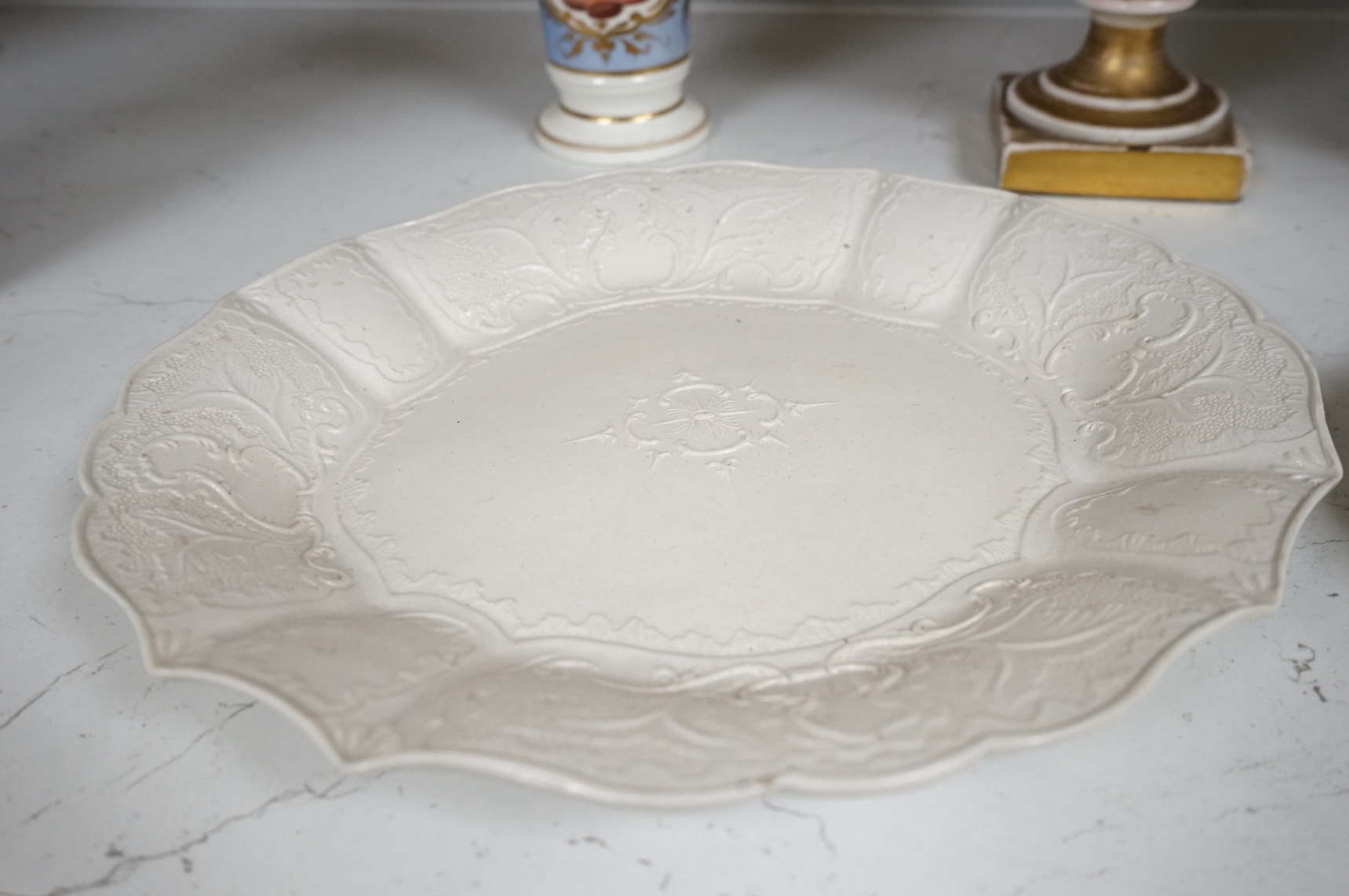 An 18th century salt glazed stoneware dish, another dish and three various vases, tallest 24.5cm. Condition - varies
